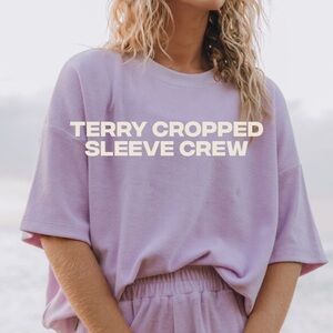 Daily Drills Towel Terry Cropped Sleeve Crew in lilac. Size XS/S